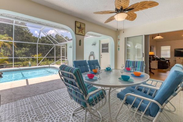 Expansive outdoor lanai with covered space perfect for outdoor living