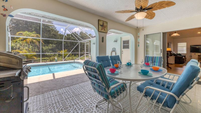 Expansive outdoor lanai with covered space perfect for outdoor living