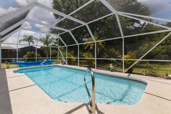 The private pool overlooks private wooded areas, no rear neighbors!