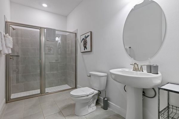 Relax in the ensuite bath, where functionality meets refined aesthetics.