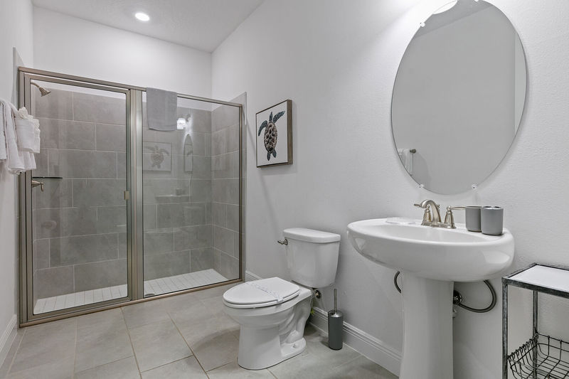 Relax in the ensuite bath, where functionality meets refined aesthetics.