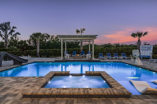 Relax in the pool area's tranquil setting, enhanced by sleek design and playful extras.