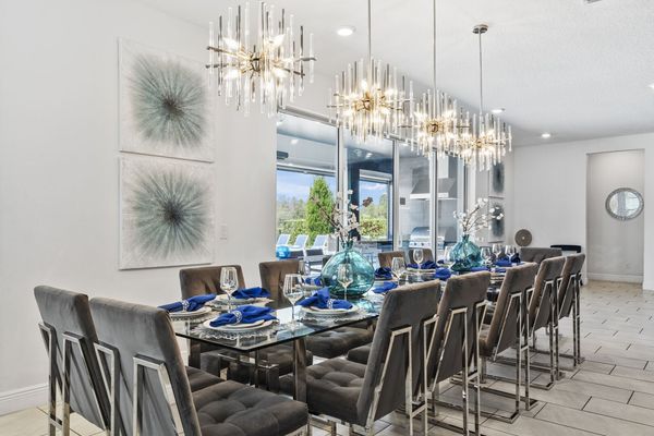 Dine in style at the formal dining table, which comfortably seats 14 guests for any occasion