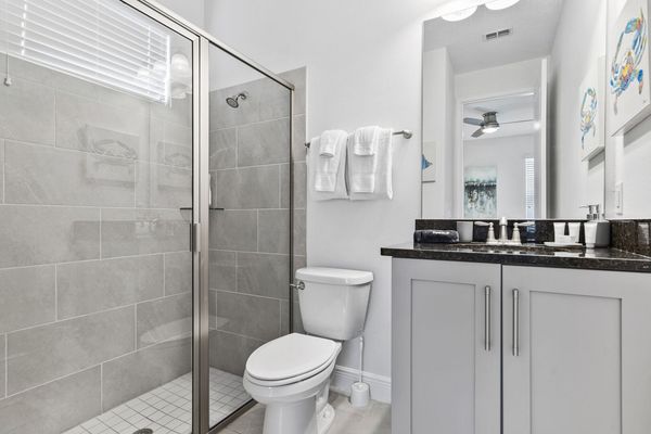Enjoy the convenience of an en-suite bathroom featuring a walk-in shower for a refreshing start to your day