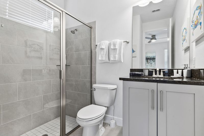 Enjoy the convenience of an en-suite bathroom featuring a walk-in shower for a refreshing start to your day