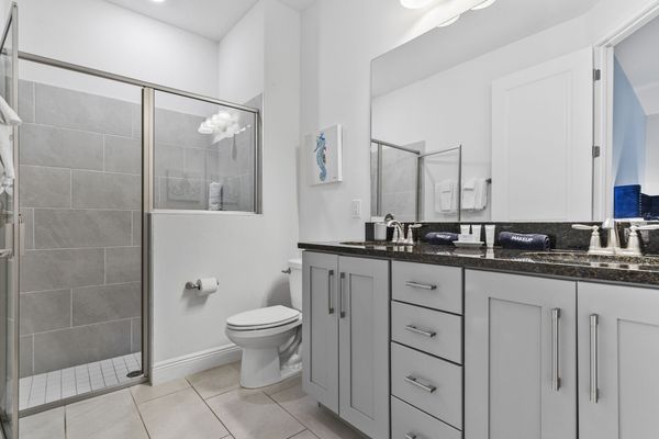 Enjoy the convenience of an en-suite bathroom featuring a walk-in shower for a refreshing start to your day