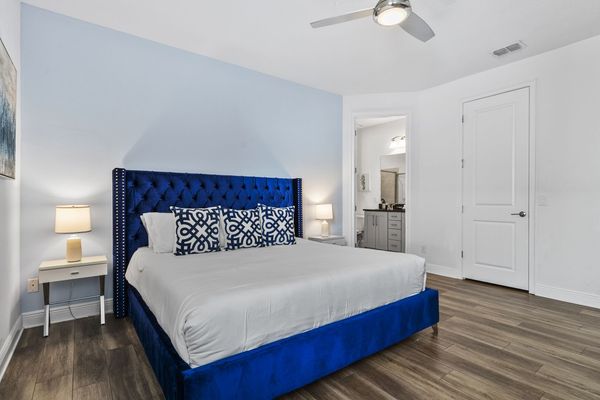 Drift off in the stylish bedroom, where modern design meets ultimate relaxation.