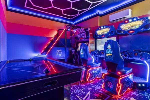 Play in style in the vibrant game room, packed with entertainment for all ages.