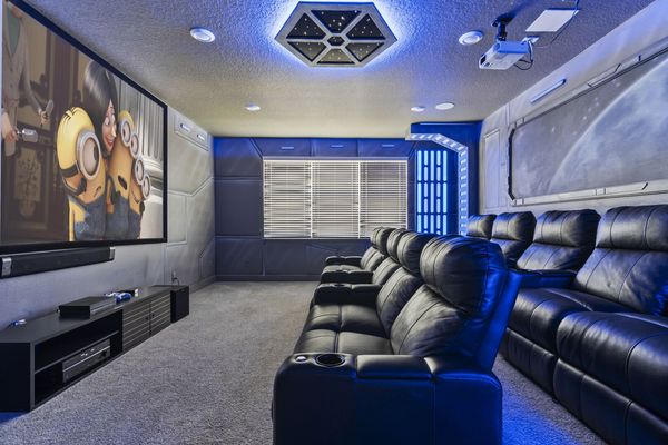 This home has its own theater room with arcades!