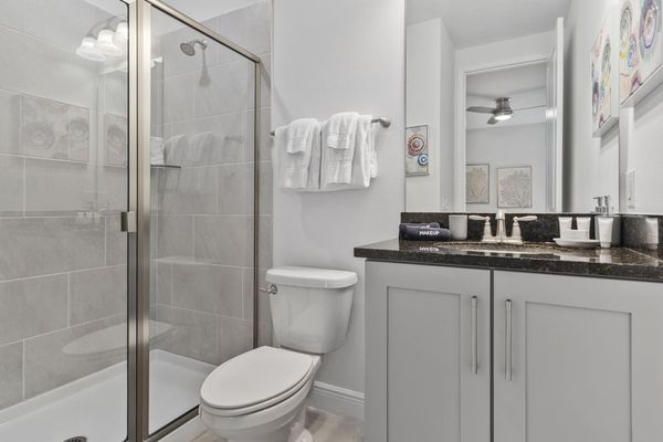 Refresh yourself in the modern shower area, featuring sleek fixtures and ample space for a rejuvenating experience