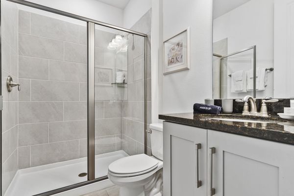 Relax in the ensuite bath, where functionality meets refined aesthetics.