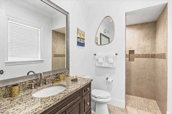 The en-suite bathroom has a walk-in shower