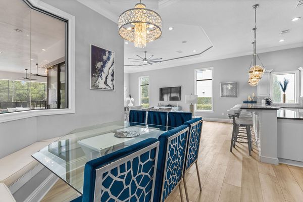 A kitchen nook to enjoy any meal with bench and dining chair seating for 12