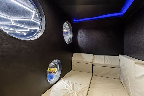 Secret playroom access to spiral slide