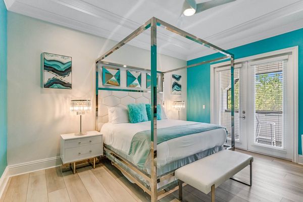 Master suite #9. King size bed, access to balcony, and en-suite bathroom