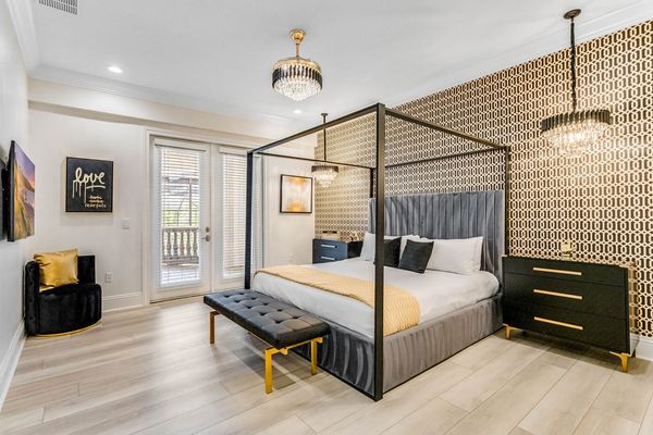 Master suite #8. King size bed, access to balcony, en-suite bathroom, and SMART TV