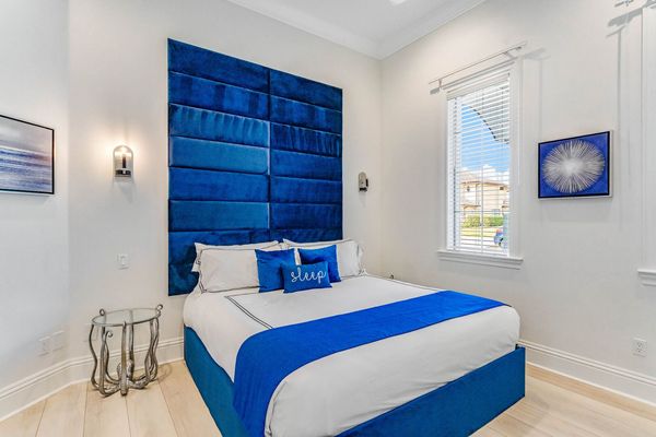 Suite # 4. A first-floor king sized bedroom with double doors and TV