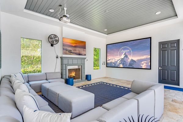 Outdoor SMART projector and comfortable lounge seating with cable and PS5 for entertainment