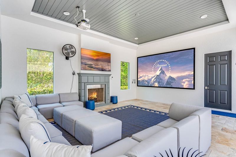 Outdoor SMART projector and comfortable lounge seating with cable and PS5 for entertainment