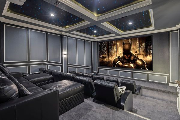 The theater room features a 200-inch projection screen, Apple TV, PS5, Xbox, and combined seating for 24