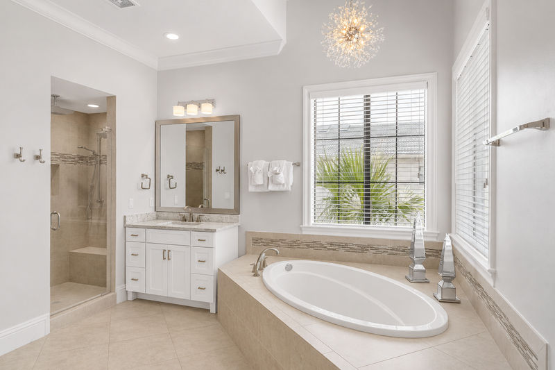 En-suite bathroom with large soaking tub and glass door walk-in shower