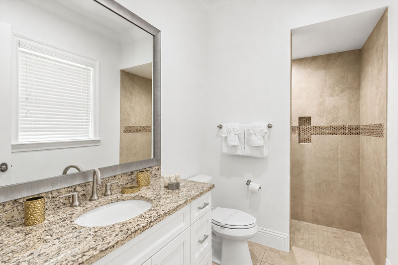 The en-suite bathroom has a walk-in shower
