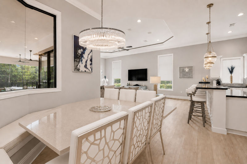 A kitchen nook to enjoy any meal with bench and dining chair seating for 12