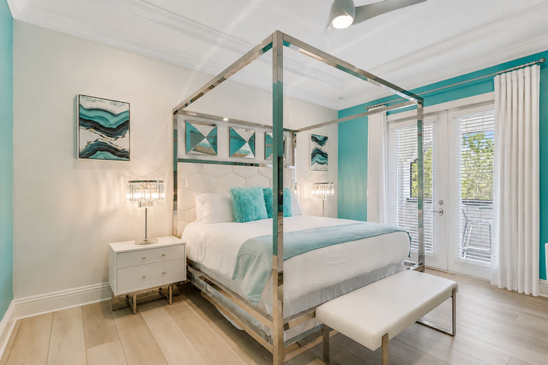 Master suite #9. King size bed, access to balcony, and en-suite bathroom