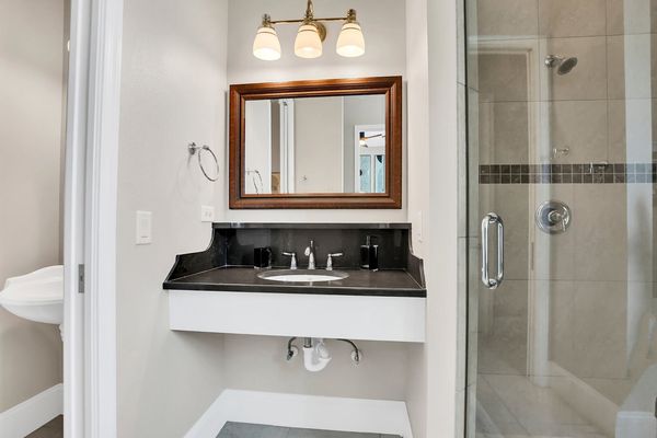 The en-suite includes a walk in shower and garden tub