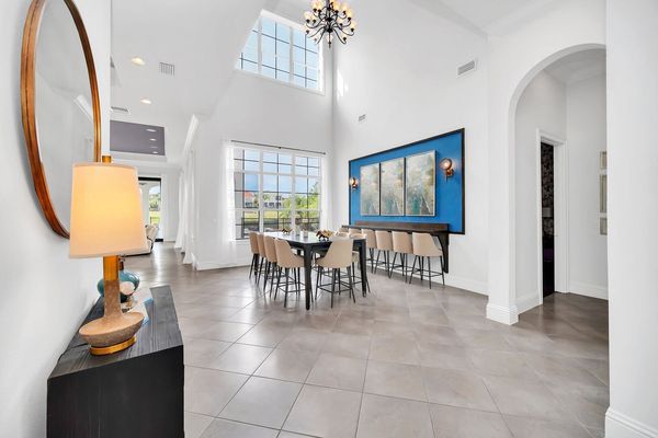 Savor every meal in style under the expansive, light-filled ambiance of our dining area, adorned with towering ceilings and breathtaking natural light pouring in through glass walls.