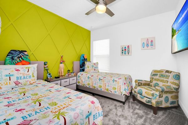 Surfs up! This beach themed room on the 2nd floor features 2 twin beds and a playstation!