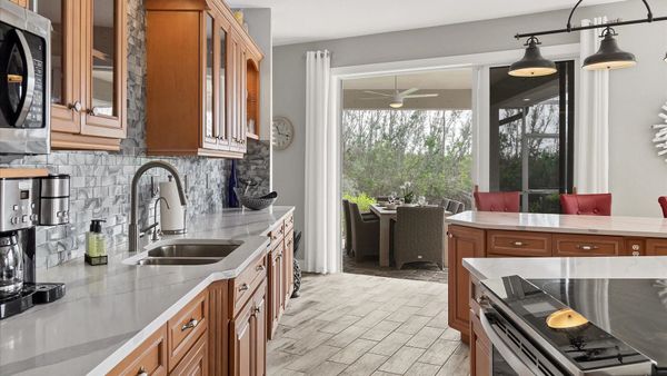 The kitchen overlooks the incredible lanai and canals