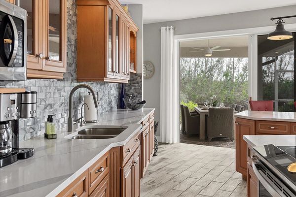 The kitchen overlooks the incredible lanai and canals