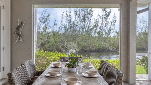 Enjoy dining al fresco by the canal and poolside