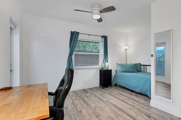 Bedroom #3. King daybed. Attached bathroom. Entry door to side walkway. Desk & chair