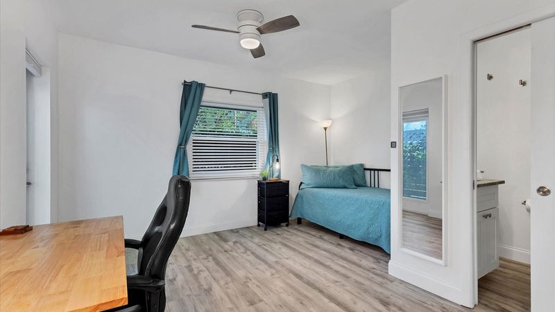 Bedroom #3. King daybed. Attached bathroom. Entry door to side walkway. Desk & chair