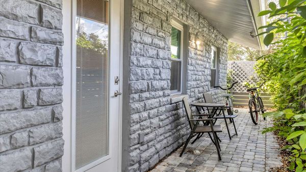 Side entry to bedroom #2. Bicycles for guest use. Bistro set