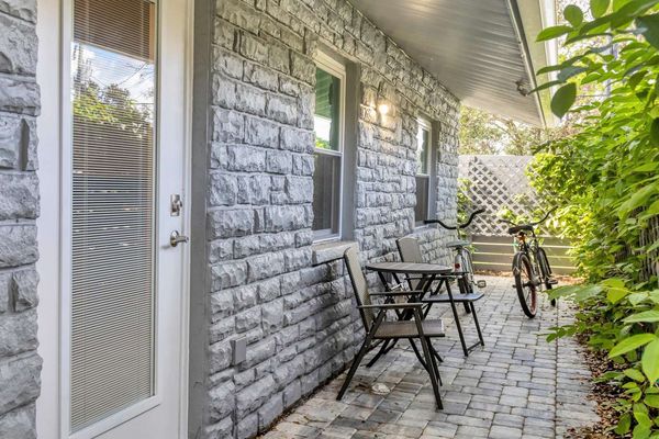 Side entry to bedroom #2. Bicycles for guest use. Bistro set