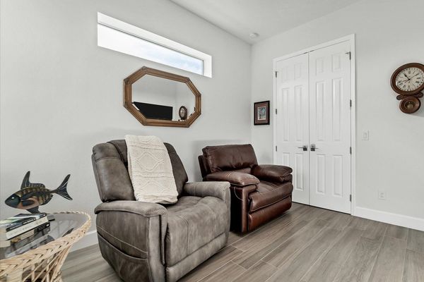 Den features 75-inch Smart TV and sleeper sofa