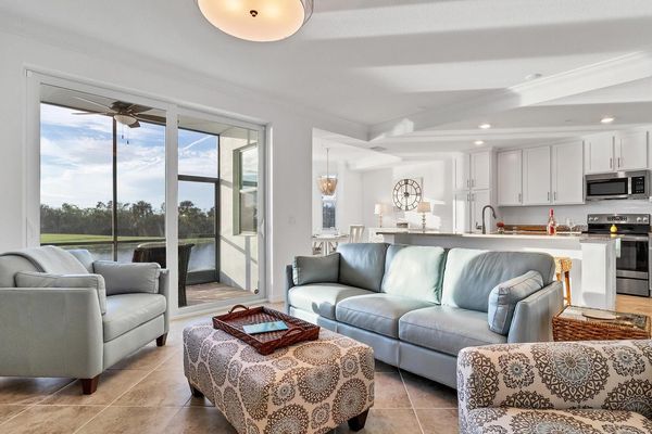 Living room overlooking the lanai and golf course