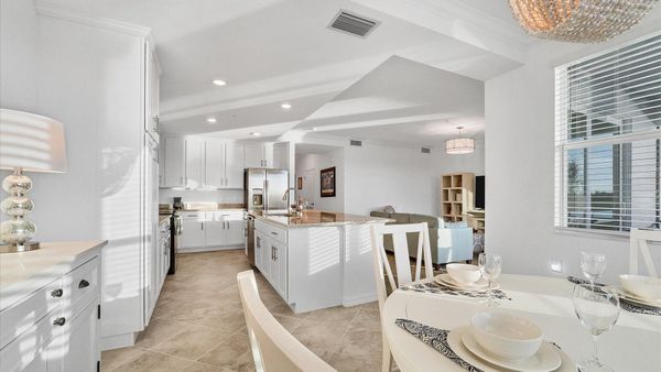 Breakfast table overlooks the golf course and kitchen