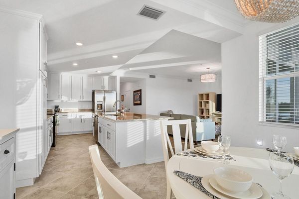 Breakfast table overlooks the golf course and kitchen