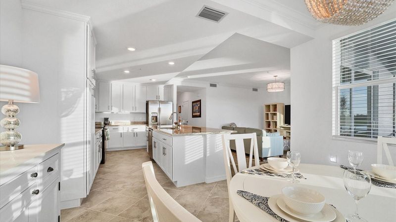 Breakfast table overlooks the golf course and kitchen