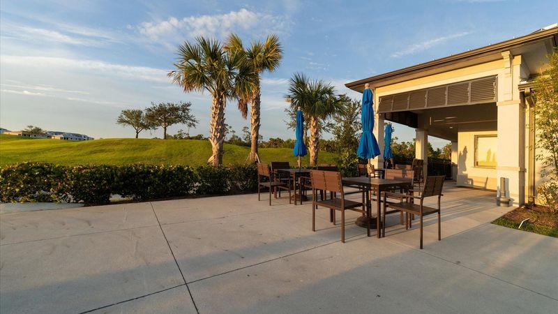Outdoor seating at the Poolside tiki bar