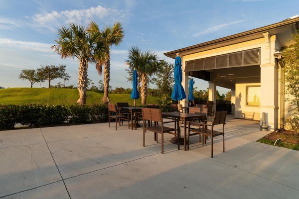 Heritage Landing clubhouse seating area by the tiki bar and poolside