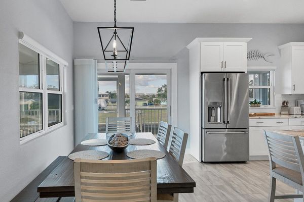 Seating for 6 at the dining table overlooking the water beyond