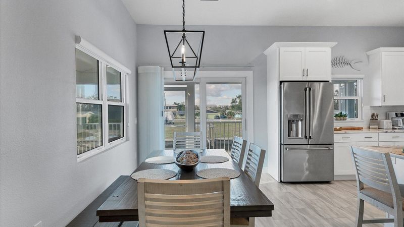 Seating for 6 at the dining table overlooking the water beyond