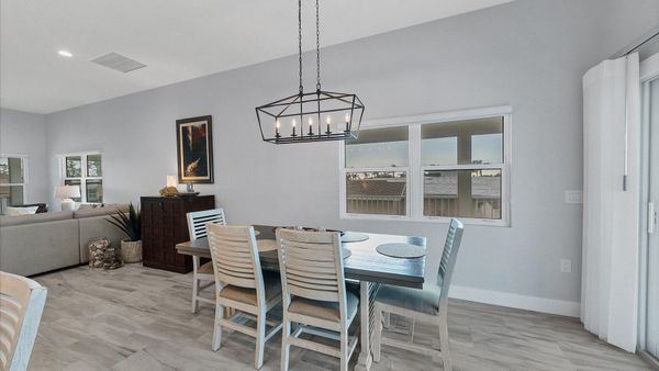 Seating for 6 at the dining table overlooking the water beyond