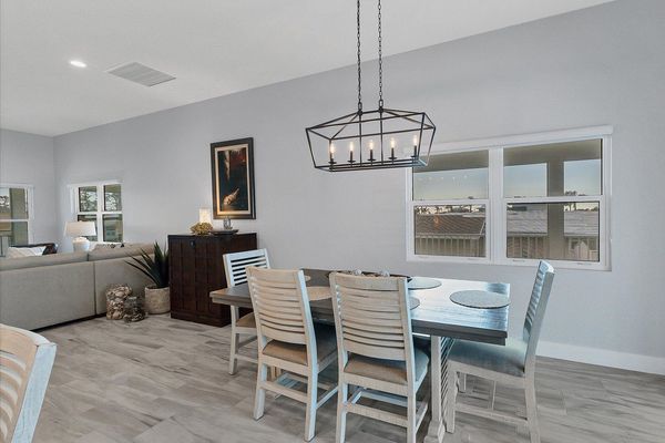 Seating for 6 at the dining table overlooking the water beyond
