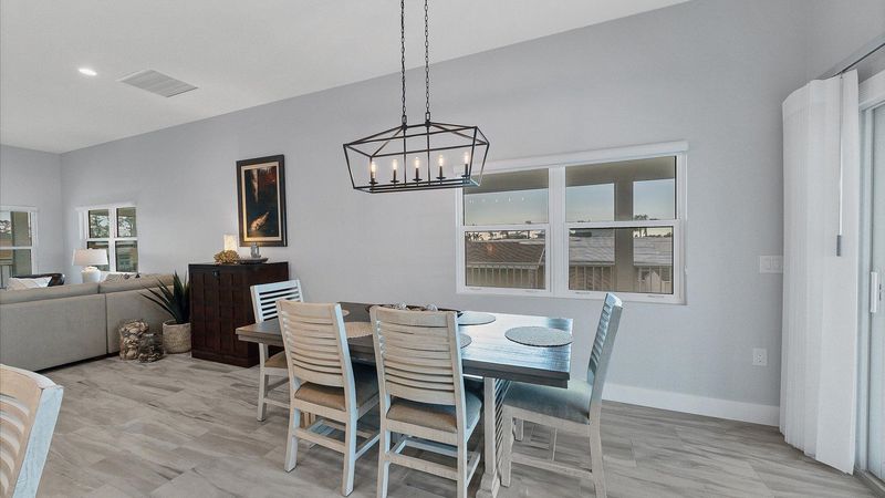 Seating for 6 at the dining table overlooking the water beyond